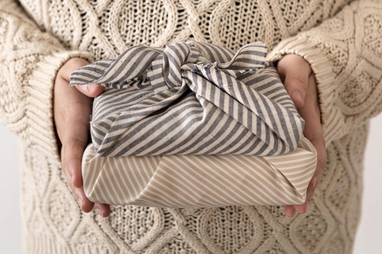 person-holding-some-wrapped-christmas-gifts