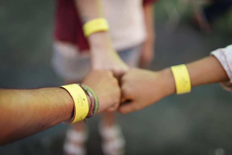 Closeup of friends put fits together unity